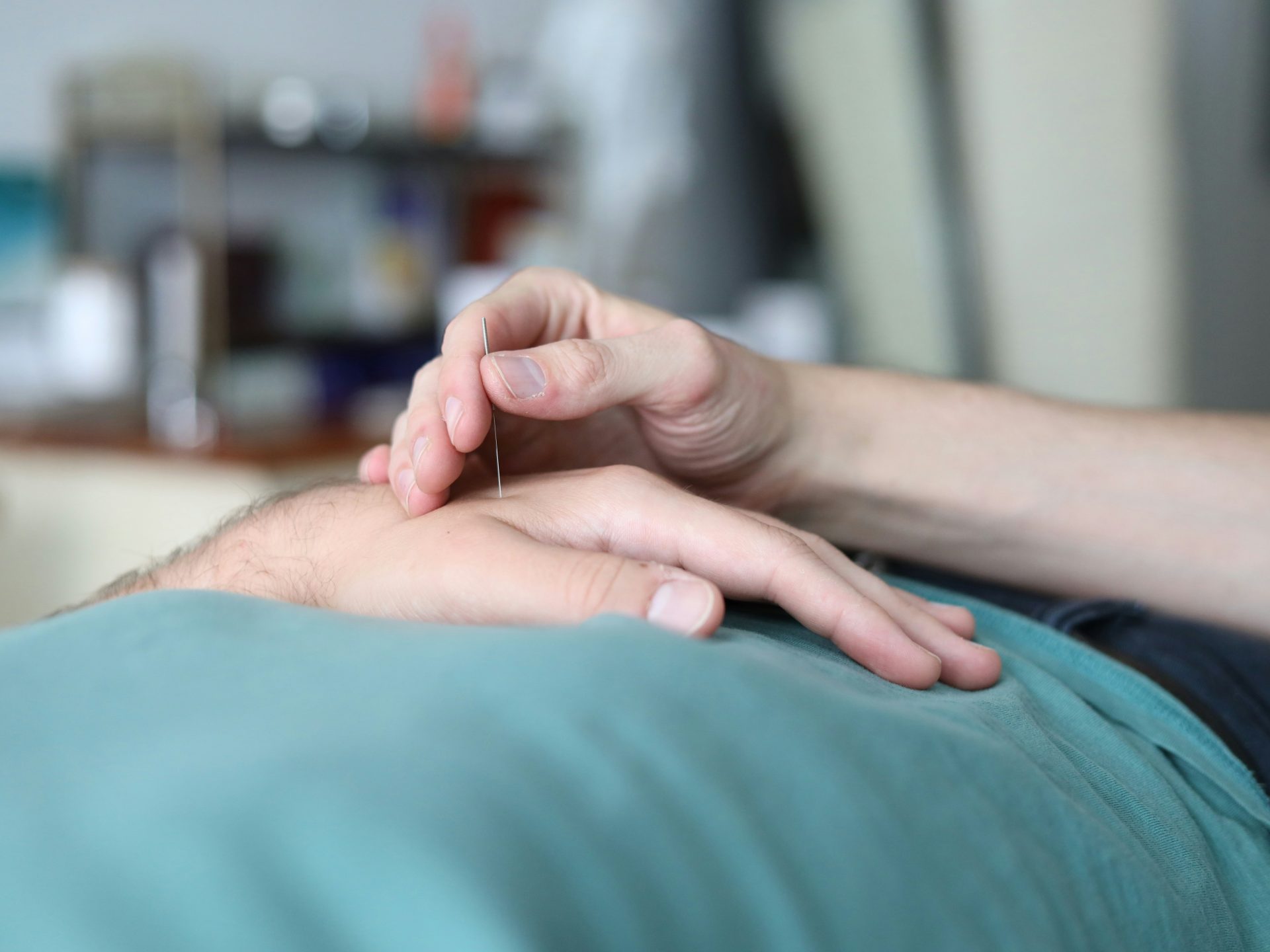 A person is holding the hand of another person